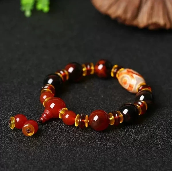Flowing Fortune Three-Eye Dzi Bracelet — Three Rings, Wealth Drawn Close
